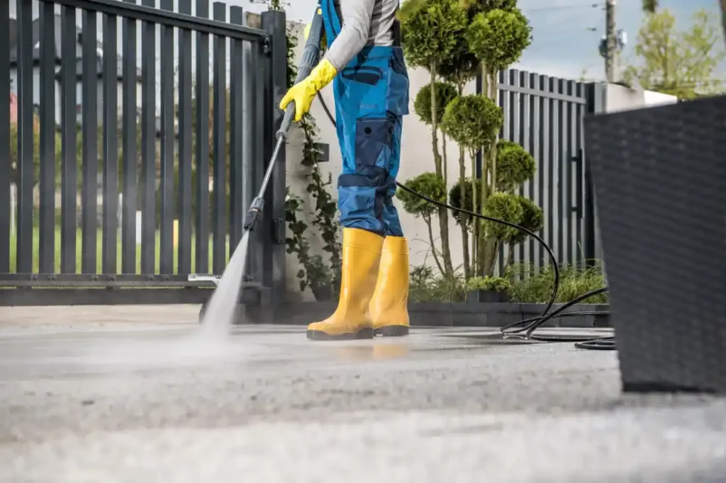 Utilizing Professional Grade Equipment to Pressure Wash a Concrete Driveway